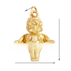 Macro detail of a golden angel pendant holding a heart with intricate wing textures