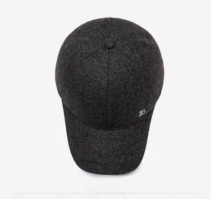Top view of dark grey winter baseball cap with textured wool fabric and metallic logo