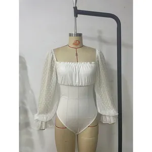 Detail of square neck bodysuit with sheer polka dot chiffon puff sleeves and ruffles