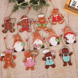Flat lay of 11-piece set gingerbread man and gnome wooden Christmas hanging ornaments