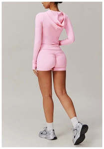 Detailed back view of pink yoga shorts with scrunch butt lifting effect and soft texture