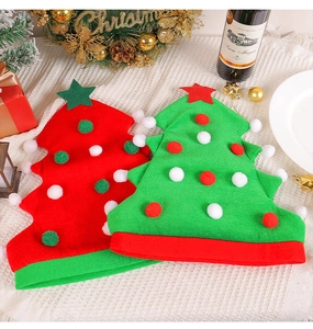 Detailed view of red and green plush Christmas tree hats with colorful pom-poms and stars