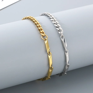 Detail of high-polish titanium steel Cuban and bar link chain in gold and silver