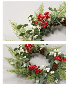 Detailed views of Christmas wreath with red berries, pine cones and eucalyptus leaves