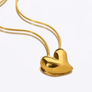Polished 18k gold crooked heart pendant necklace with elegant snake chain for women