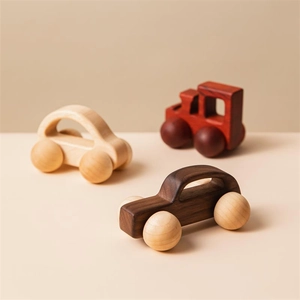 Three walnut wood minimalist toy cars in different natural wood colors for toddlers