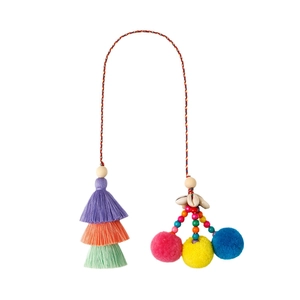 Bohemian handmade charm with colorful tassels, plush poms, and shells for bags