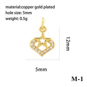 Macro detail of a gold plated heart charm with cubic zirconia and exact dimensions