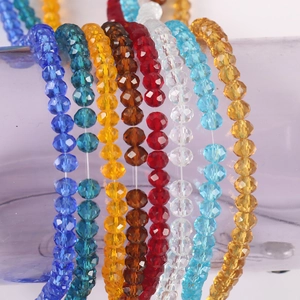 Detailed view of multi-colored faceted crystal rondelle beads for DIY jewelry making