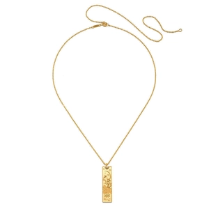 Macro detail of 18K gold plated tarot card pendant with moon relief and small diamond