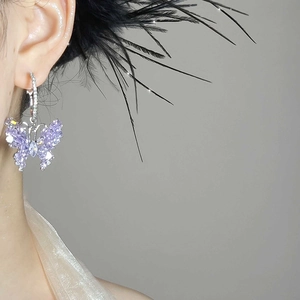Elegant silver butterfly earrings featuring sparkling purple zircons on a hoop design