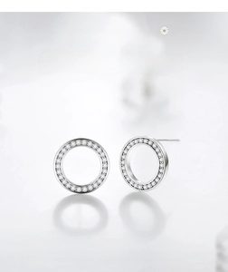 Detail view of round S925 sterling silver stud earrings with pavé cubic zirconia