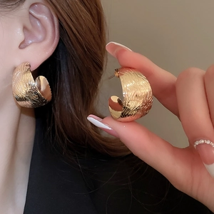 Statement golden C-shaped geometric stud earrings with textured hammer finish for women