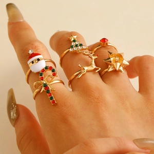Close-up of festive 6-piece adjustable Christmas ring set with enamel and rhinestones