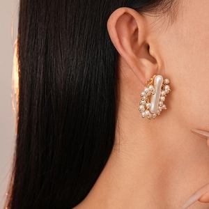 French vintage faux pearl stud earrings with irregular geometric gold metal detailing