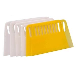 Set of 5 trapezoidal plastic scrapers in white and yellow for baking and DIY