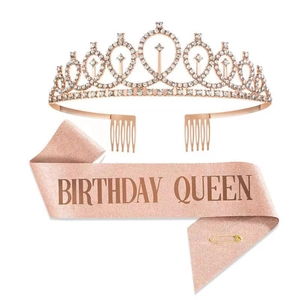 Detail of rose gold rhinestone tiara and pink Birthday Queen sash with glitter finish