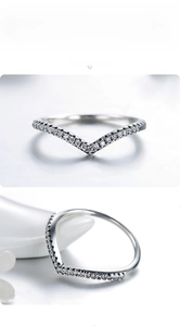 Detailed macro view of S925 sterling silver chevron ring with sparkling paved zircons