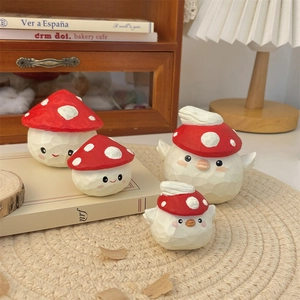 Detail of mushroom elf wood-style figurines with hand-carved textures and painted details