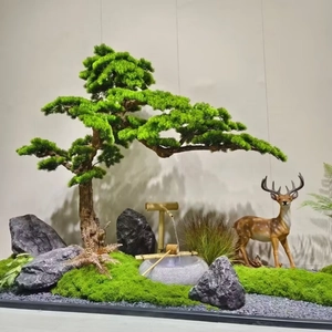 Close-up of artificial moss lawn with Zen landscape decor featuring a pine tree and deer