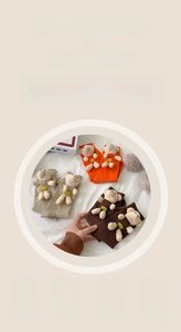 Detail of wool socks with a removable 3D plush bear and soft knitted cotton texture