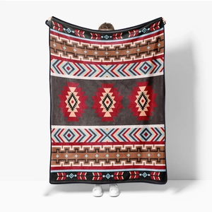 Soft flannel blanket with ethnic Southwestern geometric patterns in deep grey and red