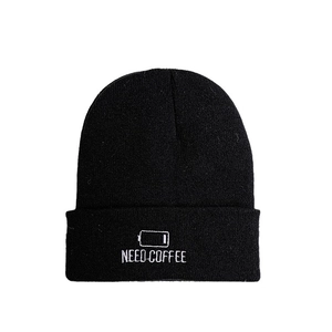Minimalist black knitted beanie with NEED COFFEE embroidery for winter warmth