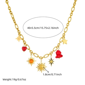 Detail view of gold sun and heart charm necklace showing length and weight measurements