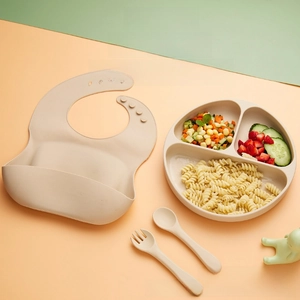 Detail of soft silicone baby bib with large pocket and divided food-grade suction plate