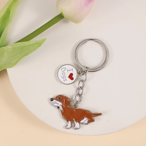 Close-up of a dachshund dog keychain with a red heart I Love Dogs engraved charm