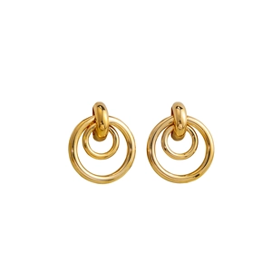 Detail of polished gold double-hoop geometric earrings with modern minimalist design