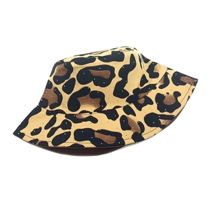 Detail of leopard print bucket hat featuring subtle silver rhinestone embellishments