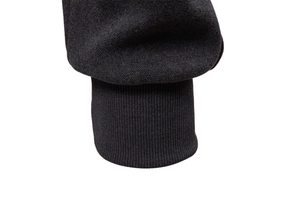 Detail shot of the ribbed cuff on a black heavy fleece sweatshirt for autumn winter
