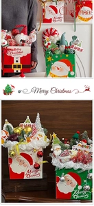 Detail view of festive Christmas gift bags with plush Santa, reindeer and mini trees