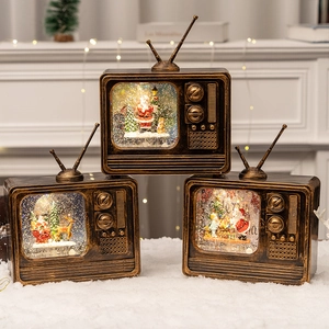 Vintage Christmas TV music box with snow globe scene and warm festive lighting