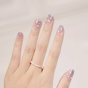 Purple gradient nail stickers with heart patterns and pearl ring for a fresh look