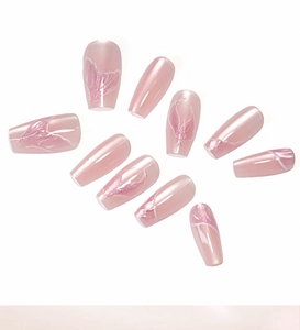 Detail of pink mermaid press-on nails featuring iridescent cat-eye texture and smoky patterns