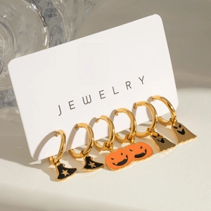 Halloween earring set with gold hoops featuring pumpkin, ghost and witch hat pendants