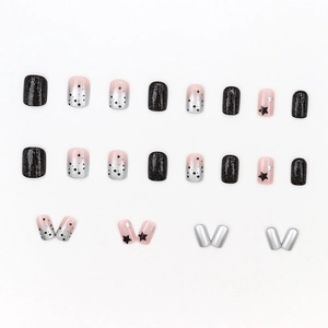 Sparkly black star press-on nails with silver glitter gradient and cute celestial designs