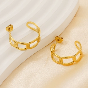 Detailed view of golden chain link hoop earrings on premium white silk background