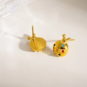 Fashion ladybug stud earrings in gold with colorful rhinestones on a white background