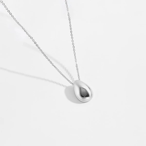 Minimalist silver teardrop pendant necklace with a polished mirror finish for women