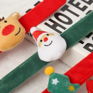 Close-up of festive LED plush Christmas slap bracelets with Santa and Reindeer figures