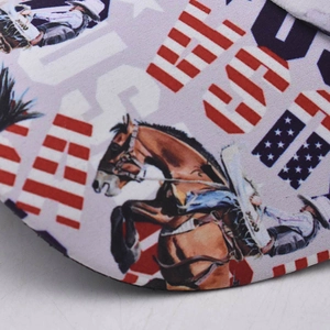 Detailed close-up of a cowboy horse print with American flag and USA logo on fabric