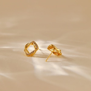 Minimalist square criss-cross stud earrings with 18K gold plating and shimmering zircons