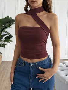 Detail of burgundy Y2K halter top with asymmetrical cut-out design and slim fit fabric