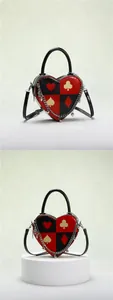 Close-up of heart-shaped poker bag with silver chain and cute heart charms detail