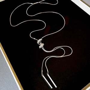 Close-up of adjustable silver snake chain necklace with micro-paved diamond accents