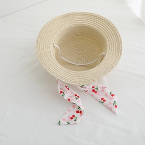 Kids flat top straw sun hat with cherry print pink ribbon and white windproof strap