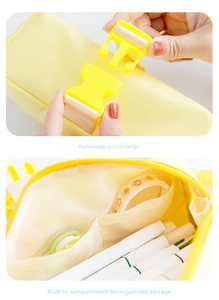 Close-up of secure plastic buckle and multi-layer internal storage of the astronaut pencil case